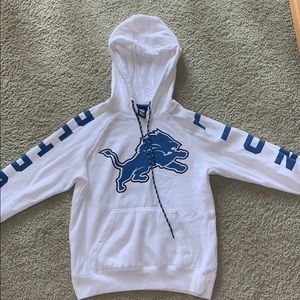 A white Detroit lions sweatshirt.